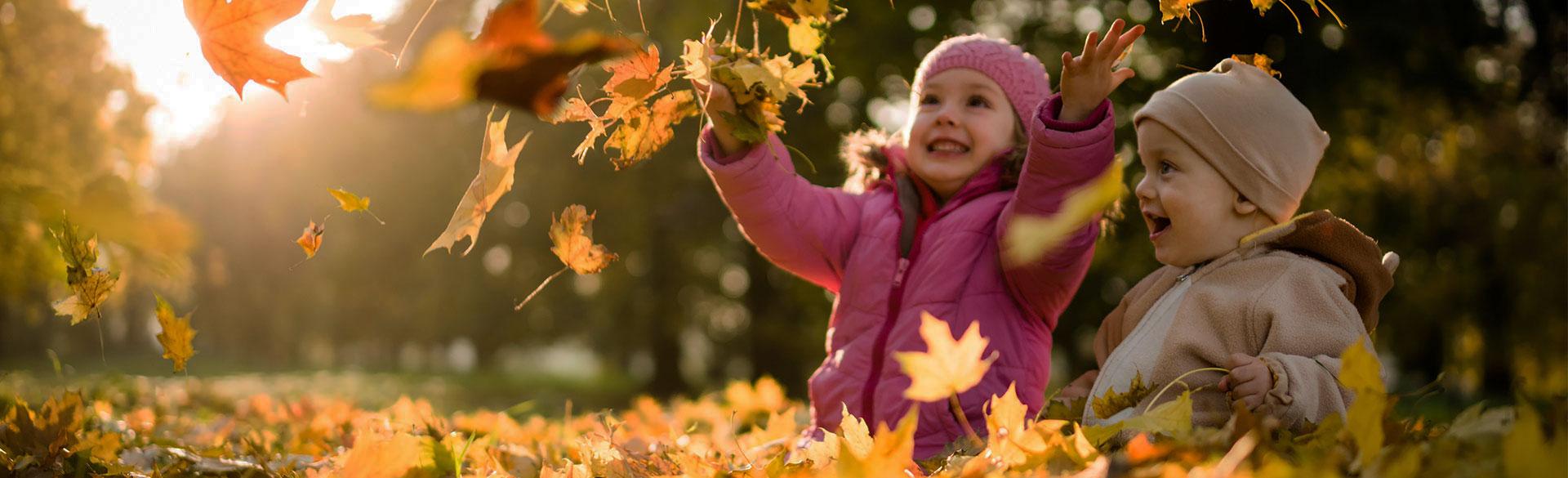 child with leaves